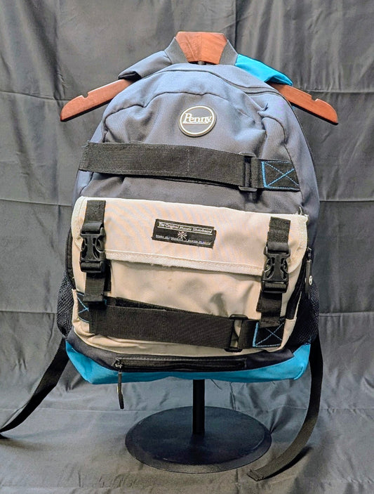 Gray and beige backpack with visible brand logo on a gray background